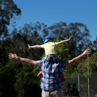 Flying on daddy's shoulders