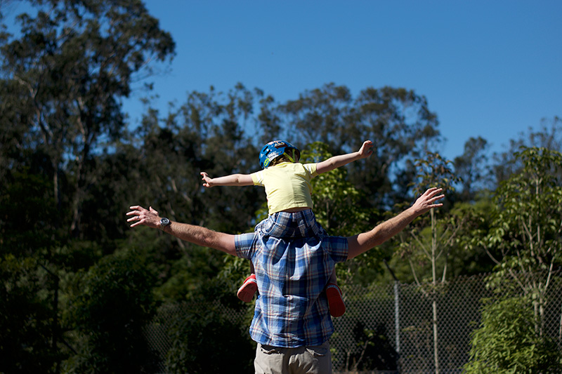 Flying on daddy's shoulders